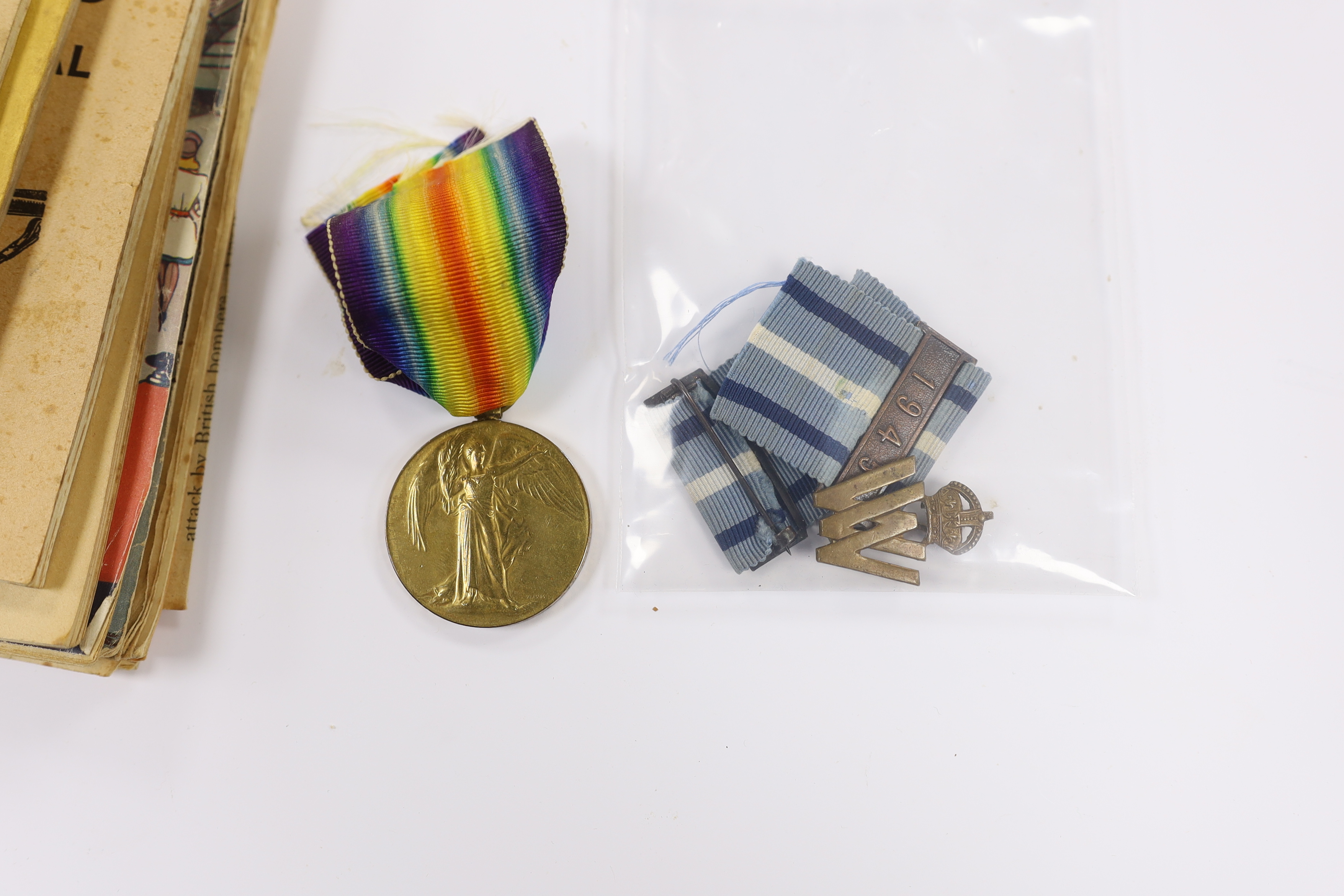 A First World War medal trio to Cpl. E.J. Hannaford, and a small collection of WWII publications including Home Guard instruction booklets, Civil Defence booklets, plus an R.L.S.S. ribbon and a WV badge, etc.